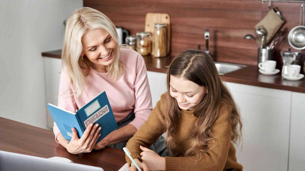 Mother and daughter learn English at home.